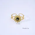 Bague ouverte dorée avec pierre noire, motif soleil et texture corde, poids de 1,1g - Ajustable / R2-Coquille Noire