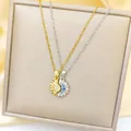 Elegant gold sun and silver moon necklaces with crystals on a champagne silk background - Two-Tone Sun Moon Magnetic Necklace