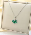 Detailed view of maple leaf pendant with green crystals on a premium jewelry stand - Green Maple Leaf (C207-1) / Silver