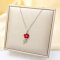 Detailed view of pink zircon sunflower pendant on a luxury titan steel silver chain - Silver - Red Sunflower