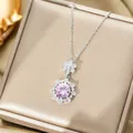 Macro shot of iris-shaped gold-plated titanium necklace with pink zircon and diamonds - Silver Necklace