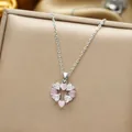 Pink heart and white crystal floral wreath pendant in titanium steel on a jewelry tray - Silver