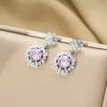 Detail view of pink iris flower earrings with zircon on a champagne gold jewelry box - Silver Stud Earrings