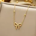 Collier avec pendentif nœud en acier titane poli et chaîne à perles sur boîte - Collier Or / Or
