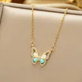 Detailed close-up of a titanium steel butterfly pendant with blue stones and opal inlay - Gold Blue Butterfly Style