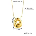 Detail of gold bubble letter necklace pendant with dimensions and 18K stainless steel specs - Letter O