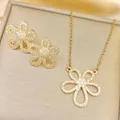 Elegant gold titanium necklace and earrings set with crystal flower petal pendants - Necklace And Earrings / Gold