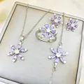Detailed view of the flower-shaped jewelry set with purple gemstones and silver finish - Purple Snowflake Collection