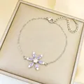 Elegant 18K gold-plated bracelet featuring a purple gemstone flower charm with zircon - Purple Snowflake Bracelet