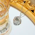 Macro view of a silver knotted necklace pendant featuring pave-set sparkling zircons - Silver Necklace