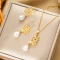 Elegant gold titanium necklace and earrings set with zircon butterflies and white pearls - Set