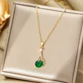 Luxurious gold necklace with emerald green zircon pendant and micro-pave diamond accents - Necklace / Gold