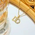 Elegant gold titanium necklace with D-letter zircon pendant and delicate O-chain link - Gold Necklace
