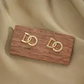 Elegant gold titanium steel D-letter stud earrings with geometric zircon circles - Gold Earrings