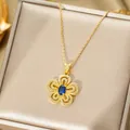 Elegant gold iris flower necklace with oval blue sapphire gemstone and white zirconia - Gold Necklace