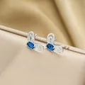 Silver iris earrings set with dark blue sapphire and white cubic zirconia accents - Silver Stud Earrings