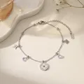 Fußkettchen aus Titanstahl mit Kleeblatt aus Muschel, Zirkonia-Anhängern und 18K Vergoldung - Silber