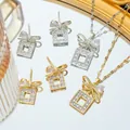 Parure de bijoux en acier titane avec nœud en zircon et pendentifs carrés or et argent - Collier Et Boucles D'Oreilles / Or