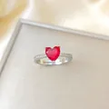 Adjustable silver ring featuring a large heart-shaped red gemstone and sparkling accents - Silver Red Heart Ring (A178)