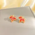 Elegant 18K gold-plated red maple leaf earrings with sparkling zircon gemstones - Gold Maple Leaf Stud Earrings