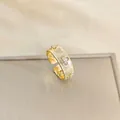Vintage gold open ring featuring brushed texture and clover hollow floral pattern - Gold