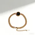 Detail view of gold stainless steel bracelet with Roman numeral dial and lobster clasp - Round Link Style / Gold
