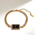 Gold stainless steel chain bracelet featuring a black Greek meander pattern dial charm - Rectangular Link Style / Gold