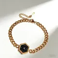 Macro detail of gold stainless steel bracelet with hexagonal dial pendant and clasp - Hexagonal Link Style / Gold