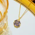 Golden titanium clover necklace featuring four purple heart zircons and bright white accents - Gold Purple