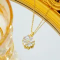 Detailed view of a gold flower necklace featuring heart-shaped zircons and micro-pave crystals - Gold White