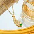Titanium steel gold leaf pendant necklace with white diamonds and green teardrop crystal - Gold