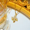 Rotating gold clover windmill necklace with sparkling cubic zirconia on a chic snake chain - Gold