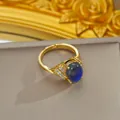 Adjustable gold plated ring with color-changing stone and sparkling side stones - Adjustable Open / Gold