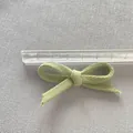 Handmade light green fabric bow accessory for DIY hair clips and clothing decorations - Bean Green