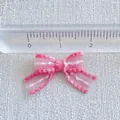 Detailed view of pink striped ribbon bow with ruler showing 2cm size for DIY crafts - Pink and White Stripes