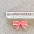Mini pink mesh bow accessory for DIY crafts and hair clips with measurement scale - Pink