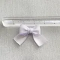 Close-up of a lavender satin DIY bow accessory measuring 3cm for hair clip and garment crafts - Lavender