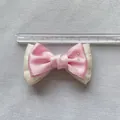 Detail shot of a pink ribbon bow accessory with silver rhinestones measuring 8cm wide - Pink Satin Cream Mesh Rhinestone Style (4)