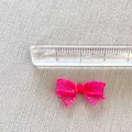 Detailed close-up showing a 2cm mini magenta mesh bow accessory with measuring ruler - Rose Red