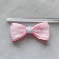 Detailed view of an 8.5cm pink satin and white lace bow accessory with a measuring ruler - Pink Satin White Lace Style (6)