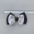 Close-up of handmade 8cm black and white cotton ribbon bow with measurement ruler - Multi Layer Polka Dot Ribbon Simple Style (6)