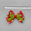 Close-up of 8cm Christmas bow hair accessory with snowflake pattern and measuring ruler - Red Green Snowflake Polka Dot Print Style