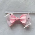 Pink silk bow with black polka dot mesh showing 11.5cm width measurement with a ruler - Pink Satin Black Polka Dot Mesh Style (8)
