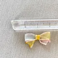 Detailed close-up of a 2cm mini mesh ribbon bow with multi-colored pastel tulle layers - Color Block