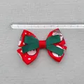 Macro shot of 8cm Christmas snowman snowflake ribbon bow with measuring ruler - Red Base Cartoon Character Contrast Style