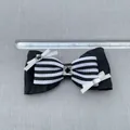 Detail showing a 9cm black striped ribbon bow accessory with crystal rhinestones - Black White Striped Ribbon Rectangular Rhinestone Style (5)