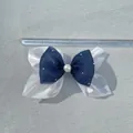 Double-layer navy and organza bow with pearls and rhinestones shown on a measuring scale - Navy Blue Heart Mesh Style (1)
