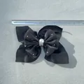 Detail of a black bow hair accessory with a white pearl, rhinestones and a scale ruler - Black Fine Glitter Rhinestone Style (4)