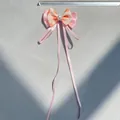 Macro detail of a pink layered satin bow hair accessory with pearls and size measurement - Orange Polka Dot Style (5)