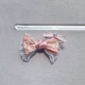 Close-up of pink floral lace bow with heart crystal detail, size approx 5.5cm wide - Pink Floral Print (4)